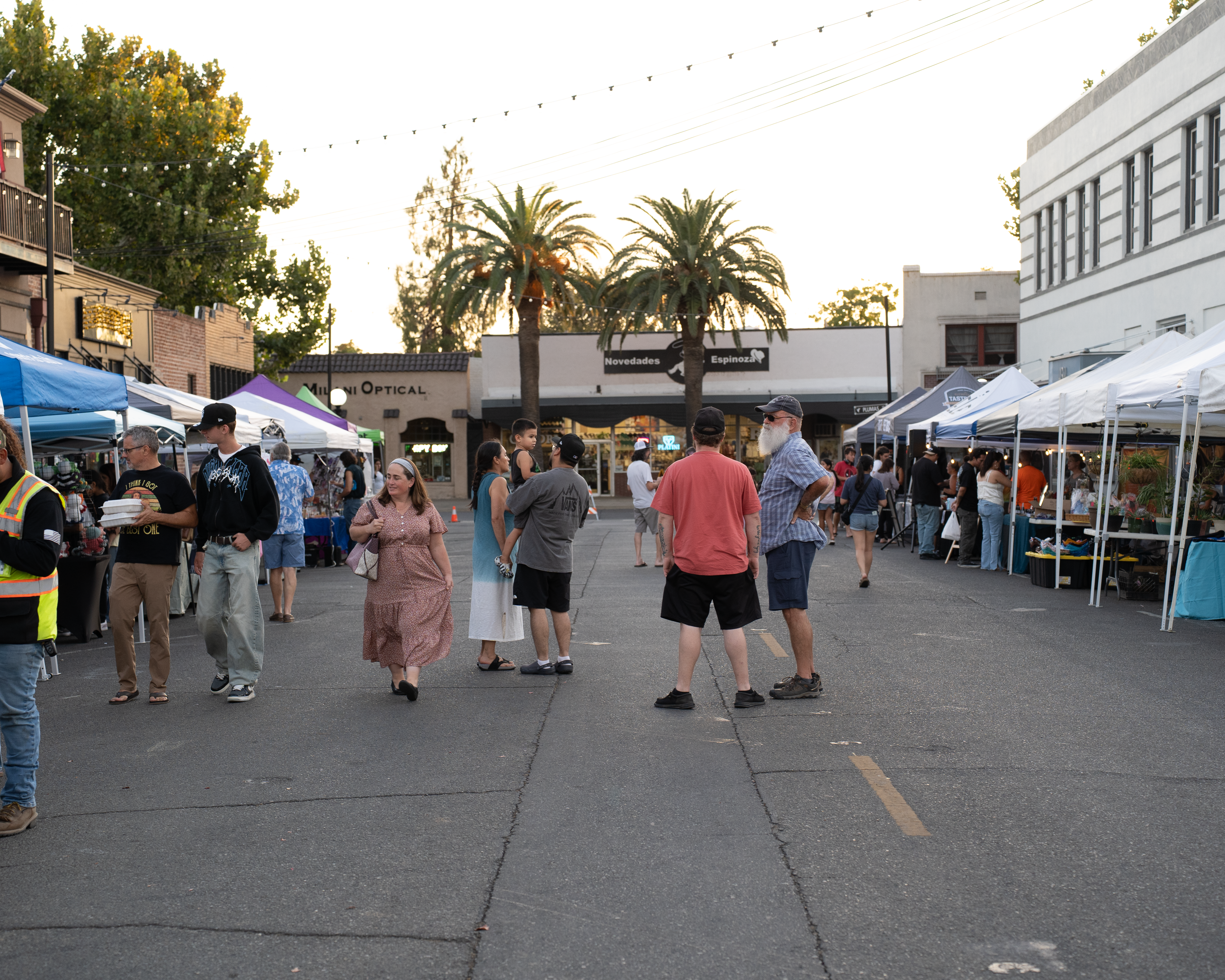 Vendors and shoppers at a community night market